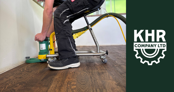 man using lagler flip sanding machine on a wooden floor